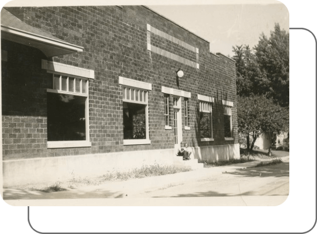 Childers Sitting Near an Old Building